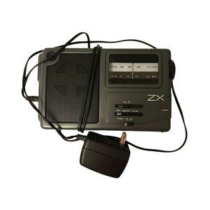 ZX Portable AM/FM Radio Model 473339 with Plug-In Adaptor